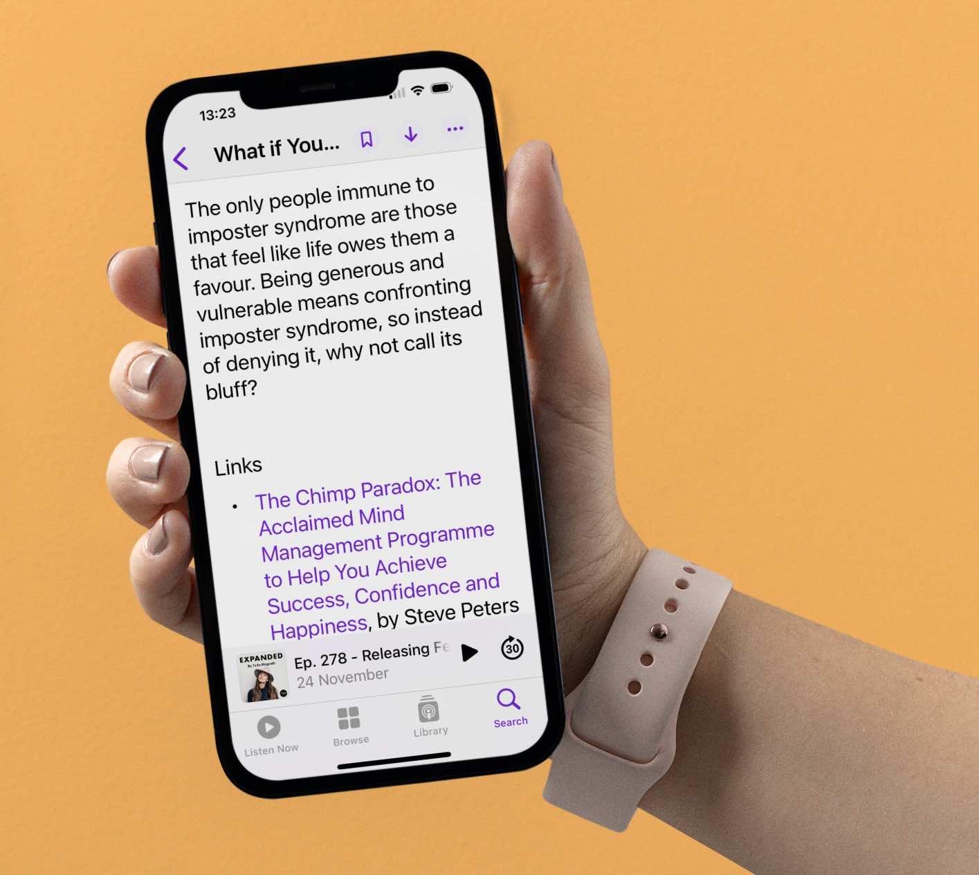 Hand holding an iPhone showing the Apple Podcasts app with an episode description